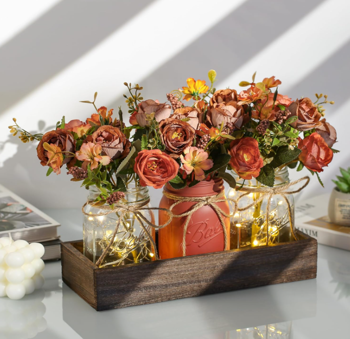 Elevate your interior décor with this sophisticated artificial flower arrangement, complete with a stylish pot and complementary small bulbs.