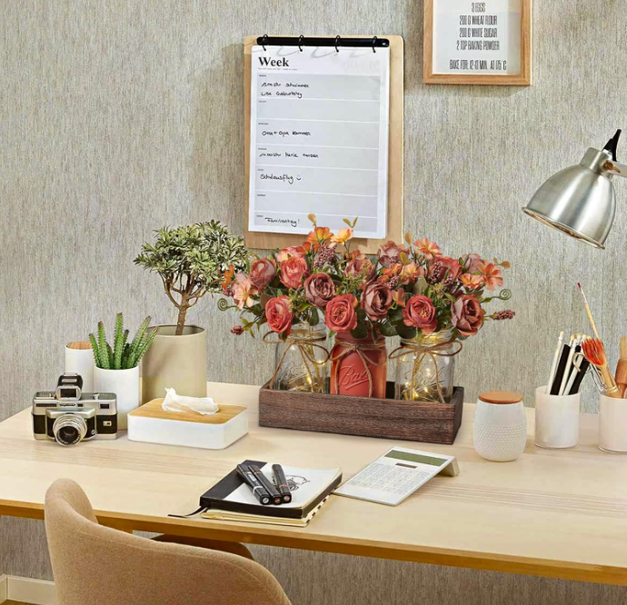 Elevate your interior décor with this sophisticated artificial flower arrangement, complete with a stylish pot and complementary small bulbs.